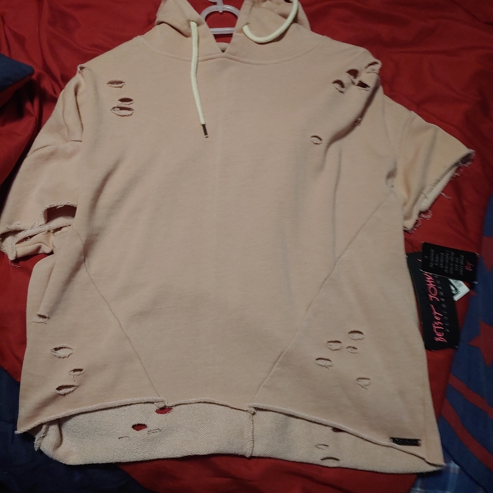 Peach sweatshirt with holes